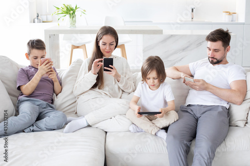 Parents and kids use devices together