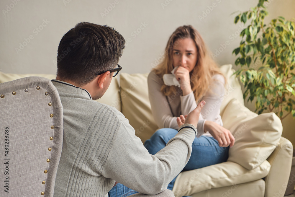 Female patient explaining purpose of a visit to psychologist Female patient explaining purpose of a visit to psychologist