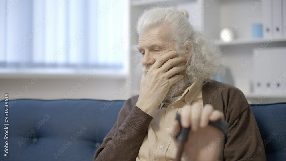 Sad grey-haired male thinking of negative life events, painful memories, regret Sad grey-haired male thinking of negative life events, painful memories, regret