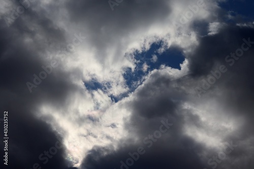 A large cottony cloud against a deep blue sky.