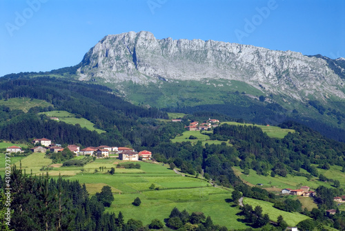 Urigoiti neighborhood under the karstic massif of Itxina. Gorbeia Natural Park. Orozko. Basque Country. Spain photo