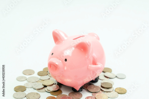 Piggy bank sitting on puzzle, understanding the ins and outs of investing