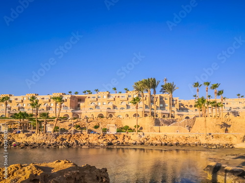 Egypt, Hurghada- AUGUST 28th 2020 Crystal clear azure water - resort with white beach - paradise coastline, beautiful buildings and ships in Hurghada, Red Sea, Egypt
