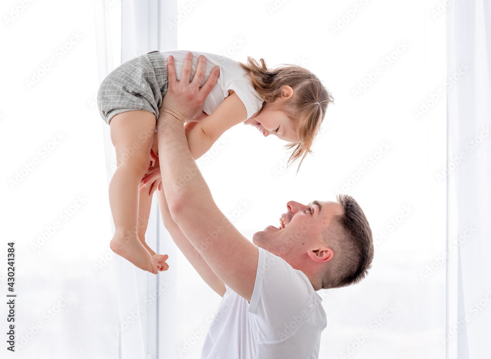 Father with daughter in the bed