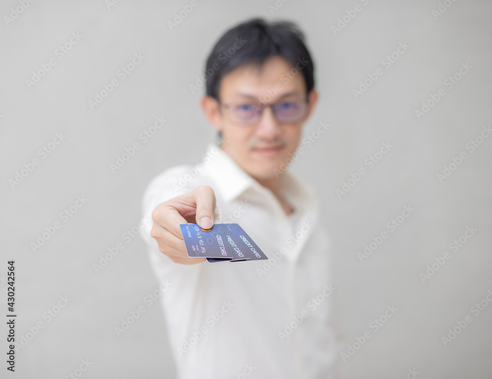 people, business, finances and money concept - close up of businessman hands holding open holding credit card people, business, finances and money concept - close up of businessman hands holding open holding credit card