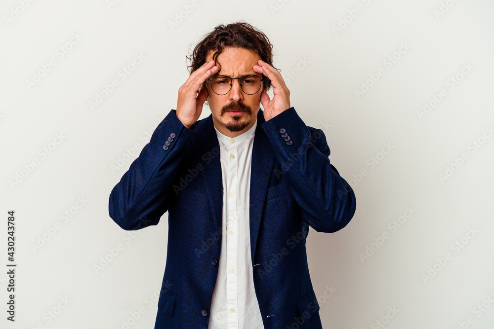 Young business man isolated on white background touching temples and having headache.