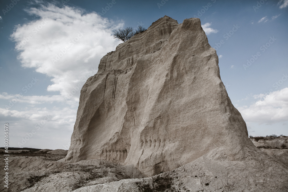 Abandoned limestone quarry. Interesting form of relief. Amazing hills and ground. Dry areas of the earth. Global warming Abandoned limestone quarry. Interesting form of relief. Amazing hills and ground. Dry areas of the earth. Global warming