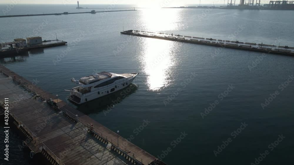 Aerial view of a cargo ship in the port dock Trade Export. Loading and unloading in deep water port, Aerial view of business logistics import and export cargo transportation