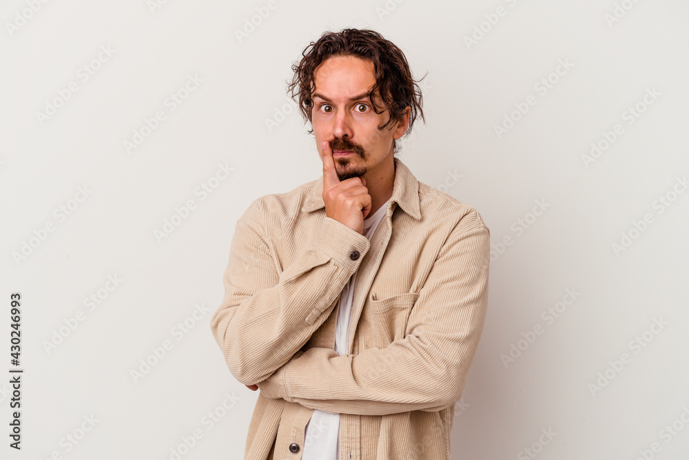 Young caucasian man isolated on white background unhappy looking in camera with sarcastic expression. Young caucasian man isolated on white background unhappy looking in camera with sarcastic expression.