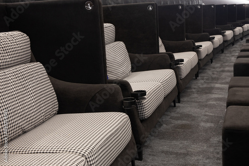 Soft fabric light double seats in row at movie theater - great entertainment fun background image