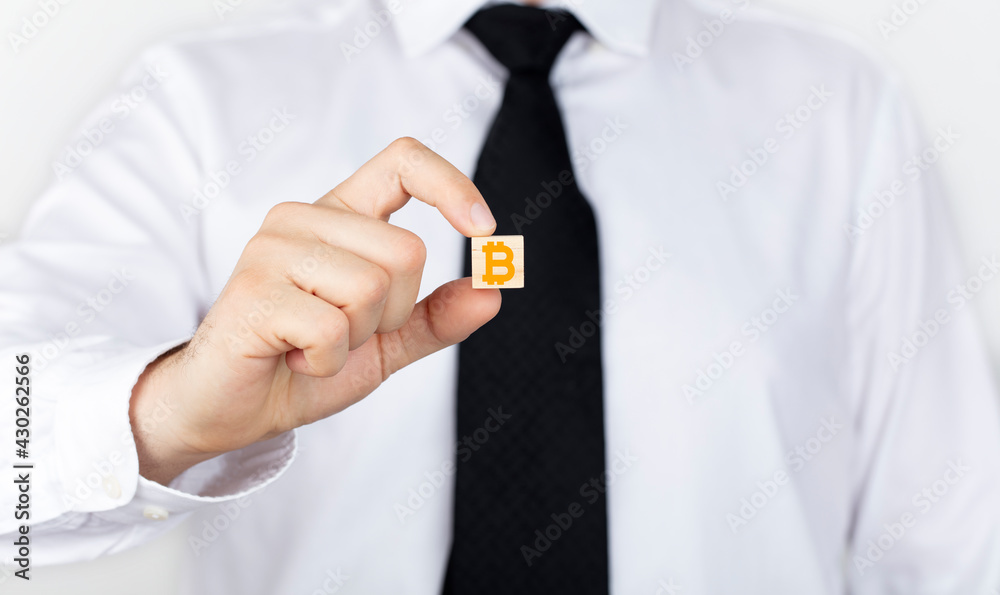 Bitcoin crypto currency blockchain currency finance investment concept. Bitcoin icon in businessman hand.
Bitcoin crypto currency blockchain currency finance investment concept. Bitcoin icon in businessman hand.