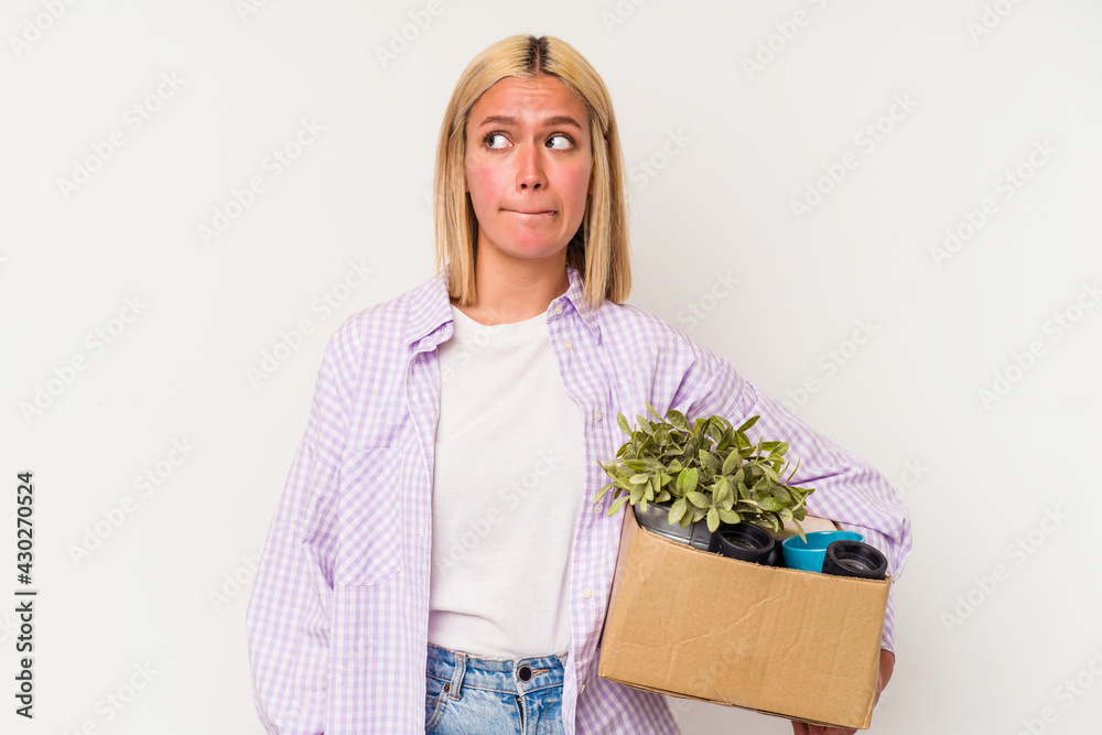 Young venezuelan woman making a move isolated on white background confused, feels doubtful and unsure. Young venezuelan woman making a move isolated on white background confused, feels doubtful and unsure.