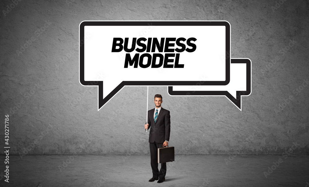 business person in casual holding road sign business person in casual holding road sign