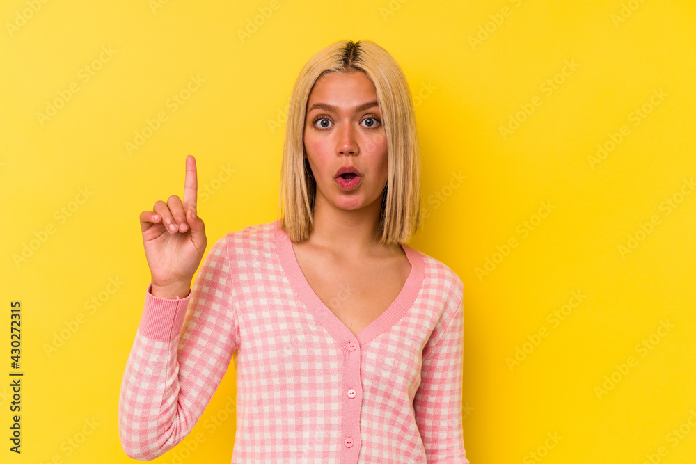 Young venezuelan woman isolated on yellow background having an idea, inspiration concept. Young venezuelan woman isolated on yellow background having an idea, inspiration concept.