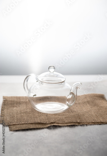 Transparent empty glass teapot isolated on white background