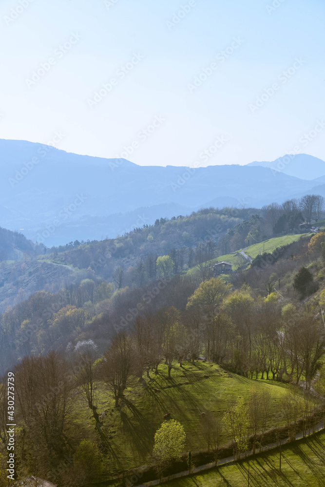 Breathtaking view of mountains in basque countries covered with  young spring grass
