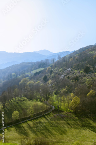 Breathtaking view of mountains in basque countries covered with  young spring grass