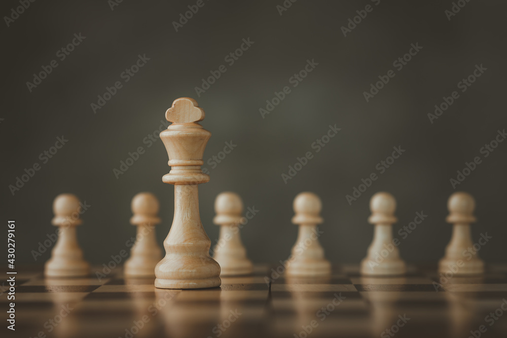 Close-Up Of Chess Pieces Against dark background, International chess, ideas and competition and strategy, business success concept, business competition planning teamwork strategic concept.