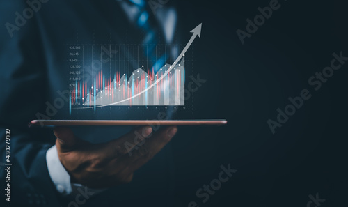 Stock Market Investments Funds and Digital Assets. businessman analyzing forex trading graph financial data from tablet. business finance technology and investment concept, technology Business finance