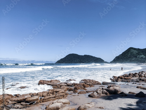 Dream beaches and tropical paradises. Beach and ocean on sunny day. Guaruja, Brazil.