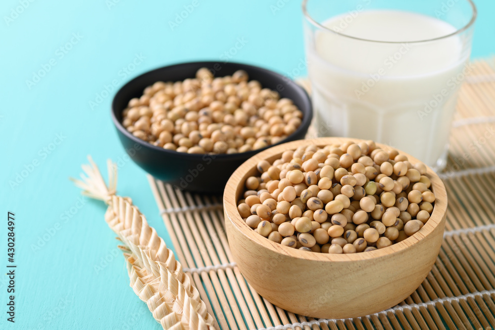 Dry soybean seeds in a bowl and soy milk, Healthy food