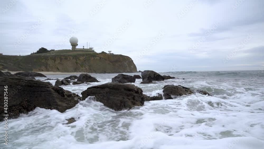 Strong waves crashing on rocks at the Pillar Point