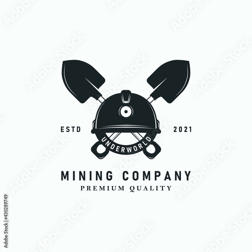 shovel or trowel logo vector vintage illustration design. helmet shovel or trowel logo concept for mining company . mining equipment or tools logo vintage vector illustration template design