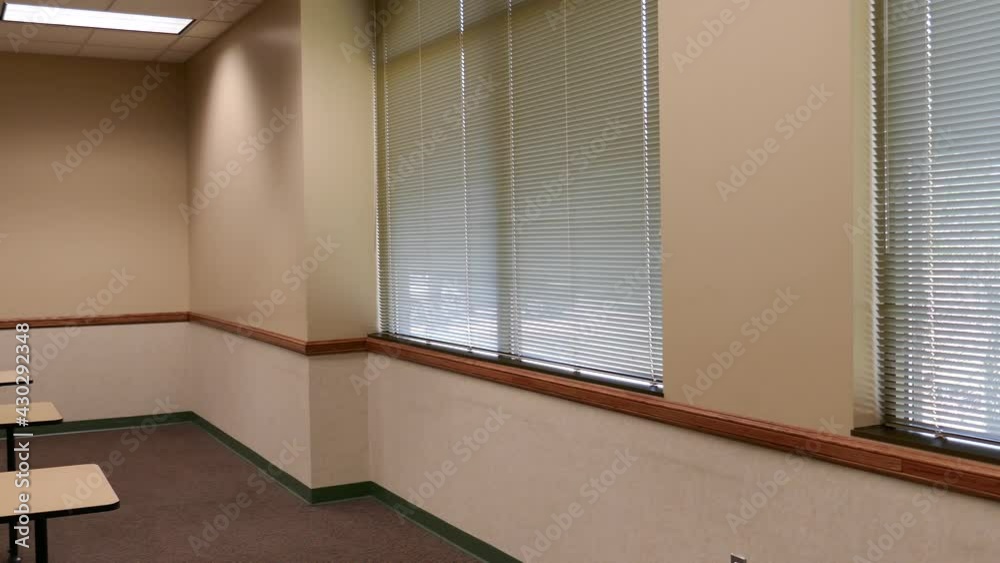 Windows with blinds in empty classroom Windows with blinds in empty classroom