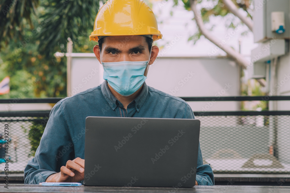 Worker Engineer working computer laptop technology, Worker Engineer wear medical mask prevent covid19 coronavirus protection Worker Engineer working computer laptop technology, Worker Engineer wear medical mask prevent covid19 coronavirus protection