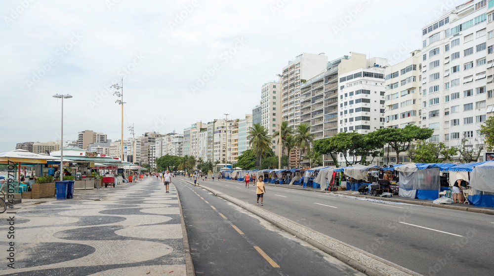  View of the Avenida Atlantica. People go about their business