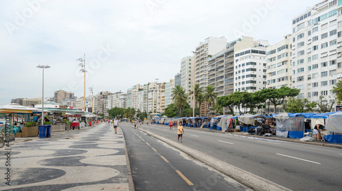  View of the Avenida Atlantica. People go about their business © aleks