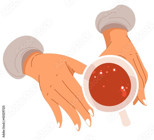 Cup of warm tea, hands holding mug with drink
