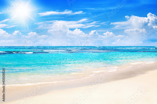 Beautiful tropical sand beach view, exotic island landscape, turquoise sea water ocean wave sun blue sky white cloud background, summer holidays vacation travel, Caribbean nature, Maldives, Seychelles