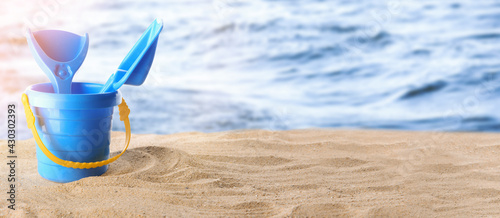 Set of beach toys for children on sandy beach