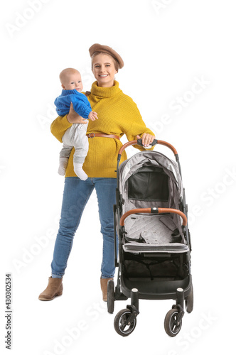 Woman with her cute baby and stroller on white background