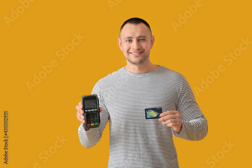 Man with payment terminal a...