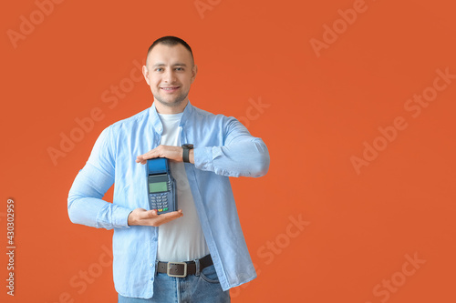Man with payment terminal o...