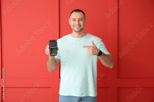 Man with payment terminal o...