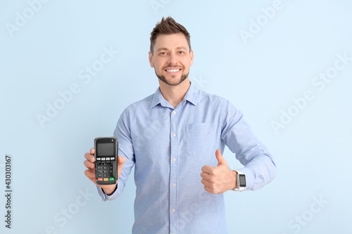 Man with payment terminal s...