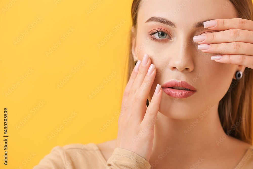 Young woman with beautiful manicure on color background Young woman with beautiful manicure on color background