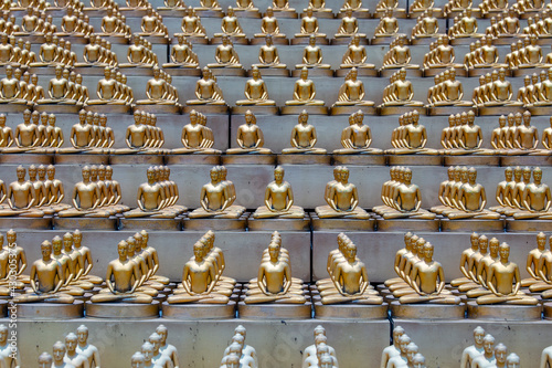 Million golden Buddha figurine in Wat Phra Dhammakaya. Buddhist temple, Bangkok, Thailand photo