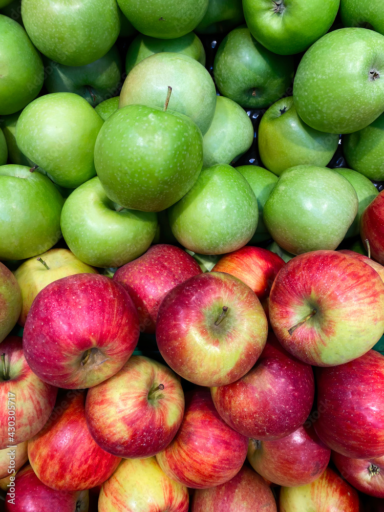 Fresh green and red apples on shelf. View from above Fresh green and red apples on shelf. View from above