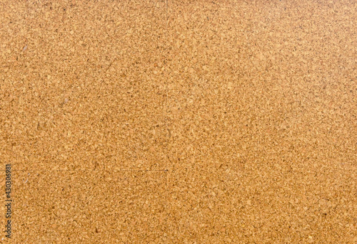 Brown and yellow color of cork board. Textured wooden background. Cork board with copy space. Notice board or bulletin board image.