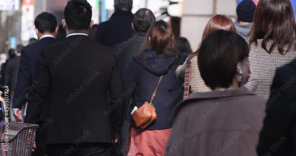 A high speed of walking office workers at urban city in Shinjuku A high speed of walking office workers at urban city in Shinjuku