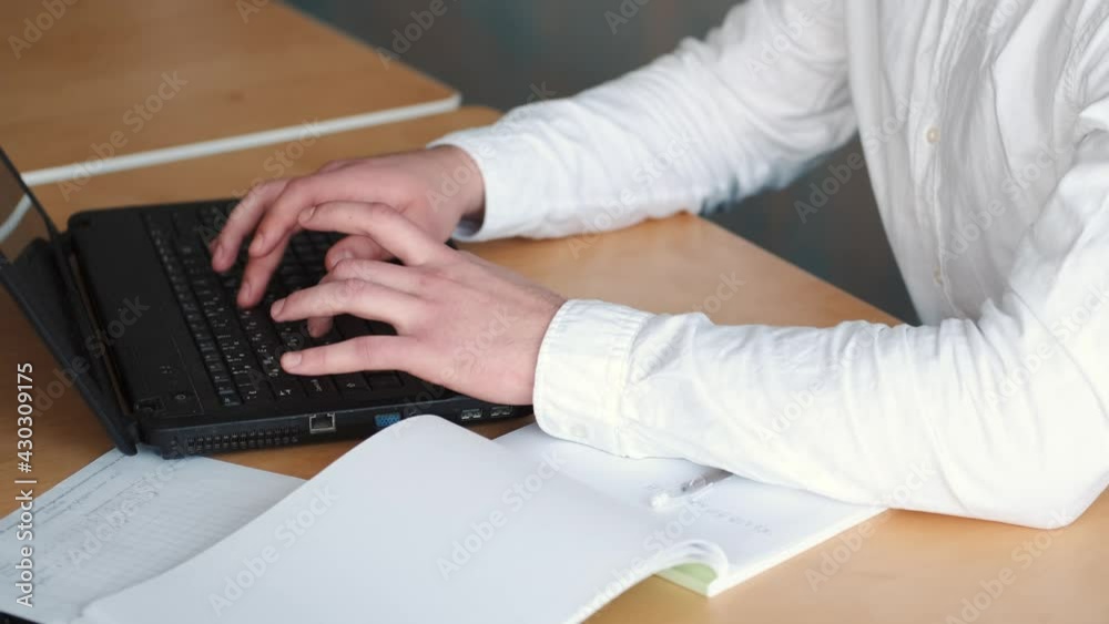 Hands typing on laptop computer at the office Hands typing on laptop computer at the office
