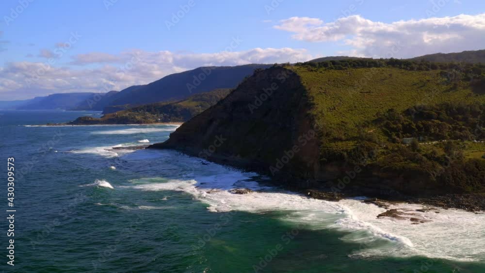 Lush Hills And Idyllic Ocean At North Era Campground In Royal National Park, Australia - aerial drone shot Lush Hills And Idyllic Ocean At North Era Campground In Royal National Park, Australia - aerial drone shot