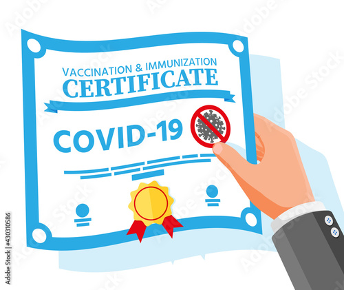 Covid-19 vaccination passport in hand.
