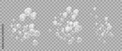 Realistic  set transparent bubbles of soapy water. Design elements for washing powder, shampoo, skin cosmetics.
Isolated on a transparent background.