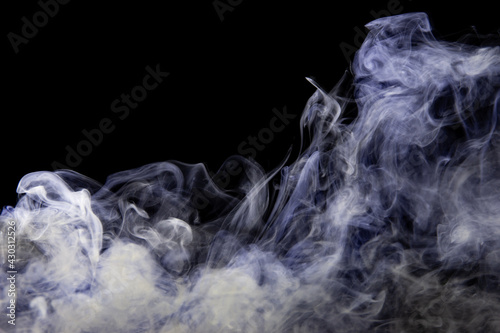 gray smoke with a blue tint on a black background