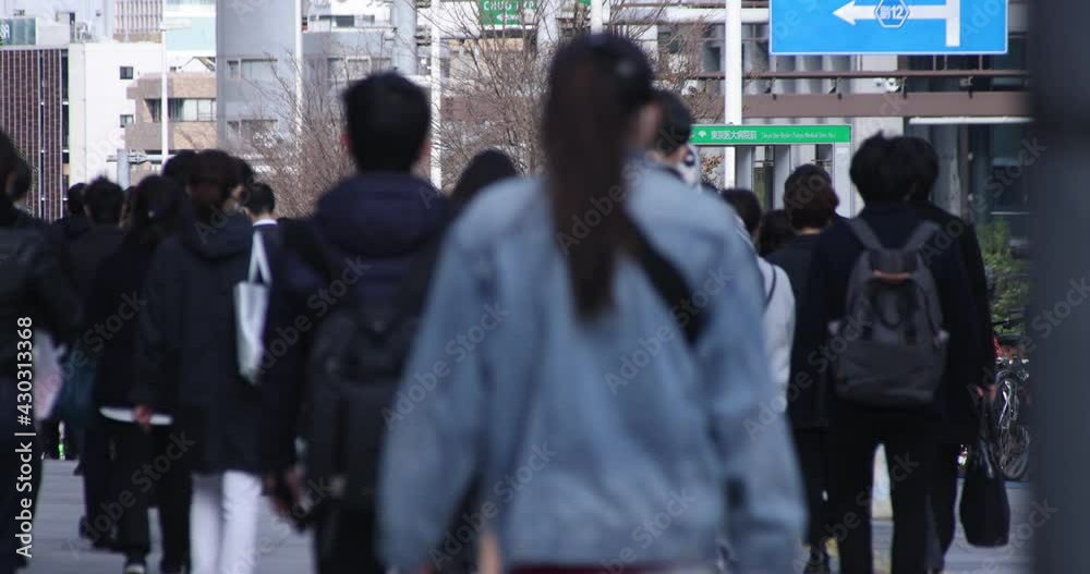 A high speed of walking office workers at urban city in Shinjuku A high speed of walking office workers at urban city in Shinjuku